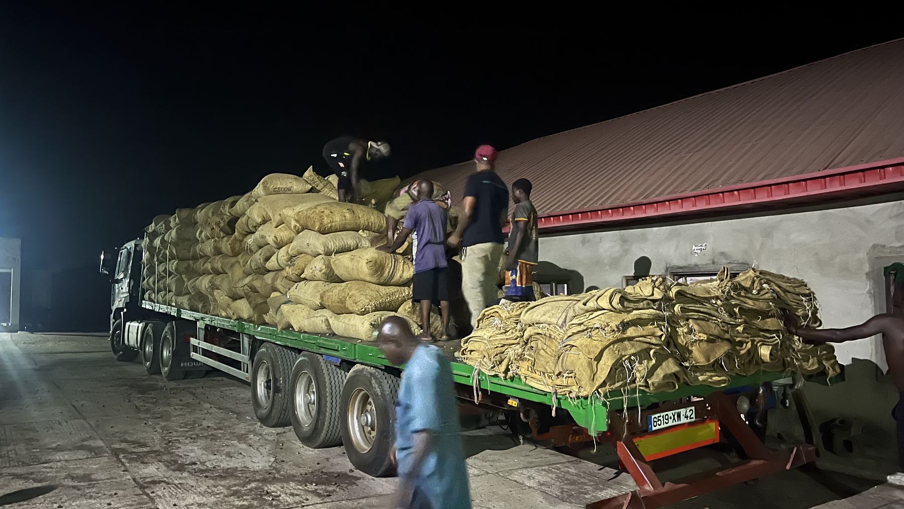 AGM team loading bulk bags of raw cashew for delivery