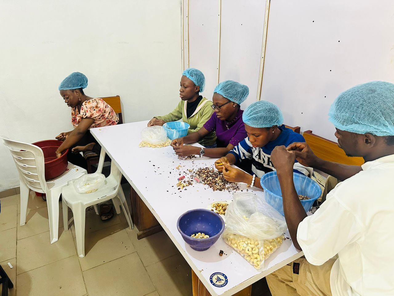 AGM processing team sorting cashew kernels